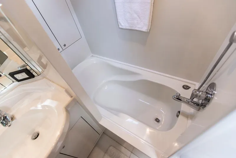 Slide: The Image of Luxurious bathroom in 2004 Ta Chiao Custom Pilothouse Cutter yacht, featuring sleek sink and bathtub. - 42