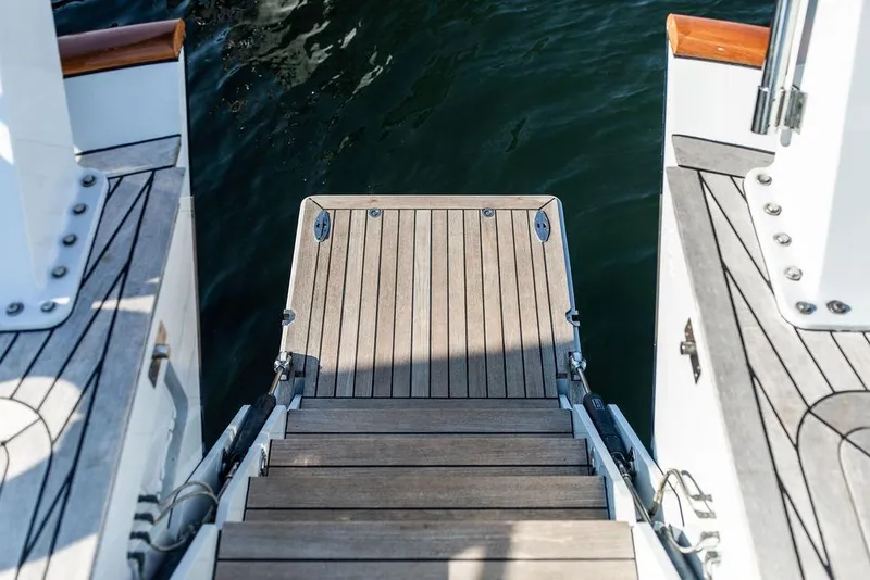 Slide: The Image of Steps leading to the water on a 2004 Ta Chiao Custom Pilothouse Cutter. - 17