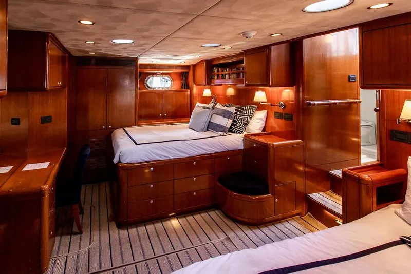 Slide: The Image of Luxurious 2004 Ta Chiao Custom Pilothouse Cutter cabin with elegant wood finish and cozy bedding. - 35