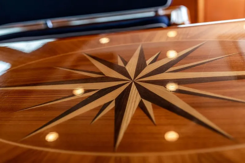 Slide: The Image of Wooden compass rose inlay on Ta Chiao 2004 Custom Pilothouse Cutter table. - 26