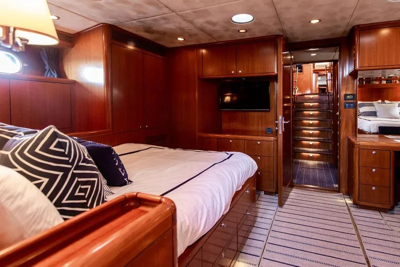 Slide: The Image of Luxurious 2004 Ta Chiao Custom Pilothouse Cutter interior with elegant wood finish and cozy bedding. - 37
