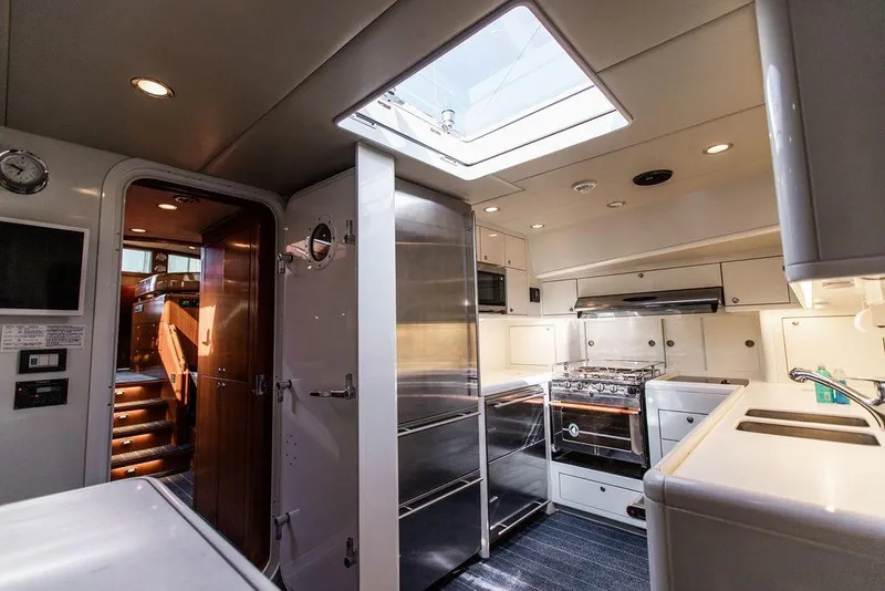 Slide: The Image of Luxurious 2004 Ta Chiao Custom Pilothouse Cutter interior with modern kitchen and skylight. - 46