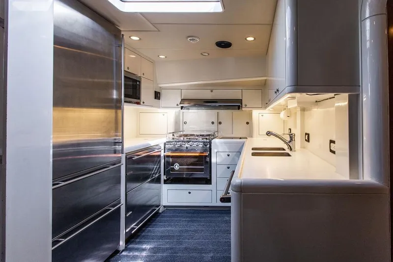 Slide: The Image of Modern kitchen interior of 2004 Ta Chiao Custom Pilothouse Cutter yacht, featuring sleek appliances and cabinetry. - 47