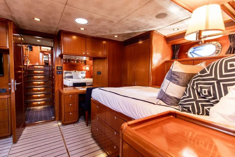Slide: The Image of Luxurious 2004 Ta Chiao Custom Pilothouse Cutter interior with elegant wood finish and cozy bedding. - 36