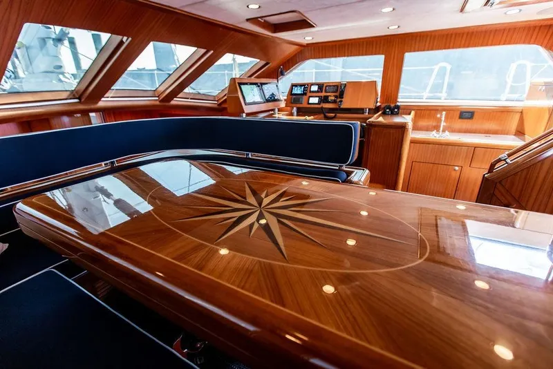 Slide: The Image of Luxurious 2004 Ta Chiao Custom Pilothouse Cutter interior with elegant woodwork and navigation equipment. - 25
