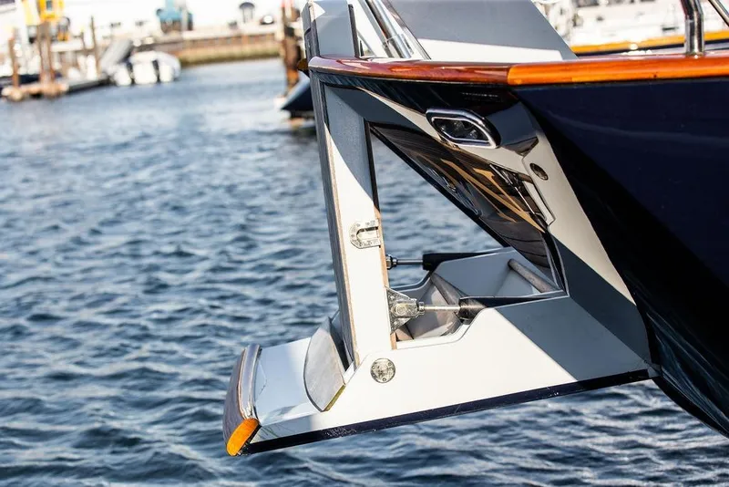 Slide: The Image of Stern view of 2004 Ta Chiao Custom Pilothouse Cutter, featuring a sleek swim platform. - 19