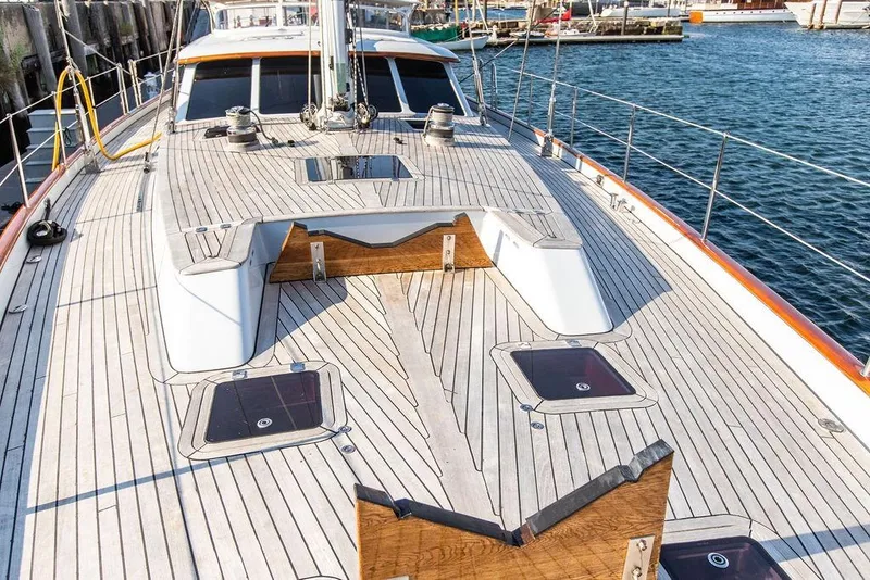 Slide: The Image of 2004 Ta Chiao Custom Pilothouse Cutter deck with wooden finish, docked at marina. - 3