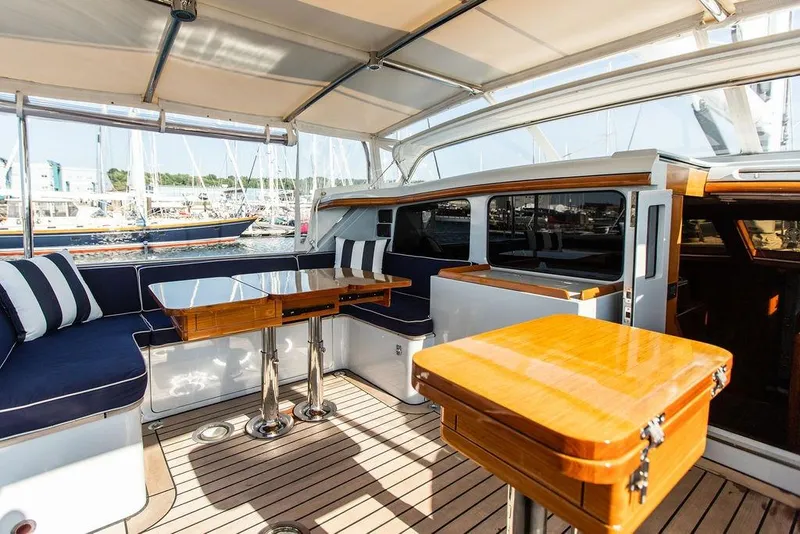 Slide: The Image of Luxurious 2004 Ta Chiao Custom Pilothouse Cutter with elegant seating and polished wood tables. - 8