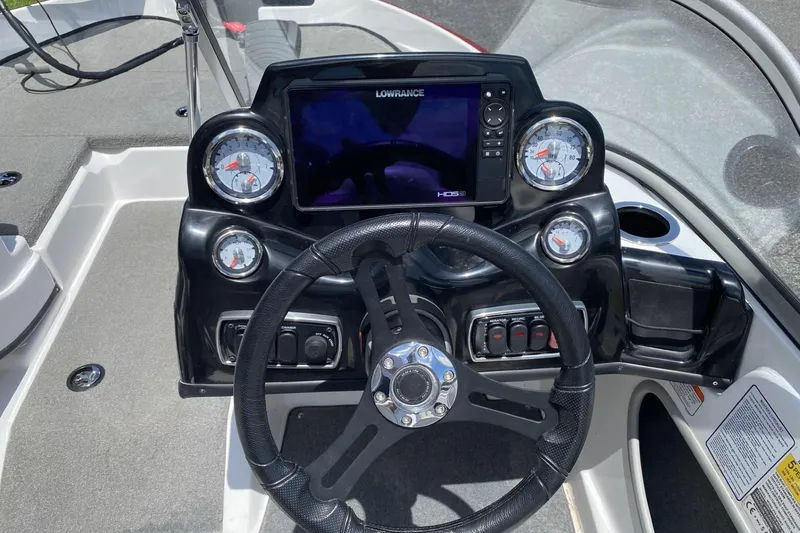 Slide: The Image of Dashboard of a 2021 Nitro Z19 Sport boat with steering wheel and gauges. - 2