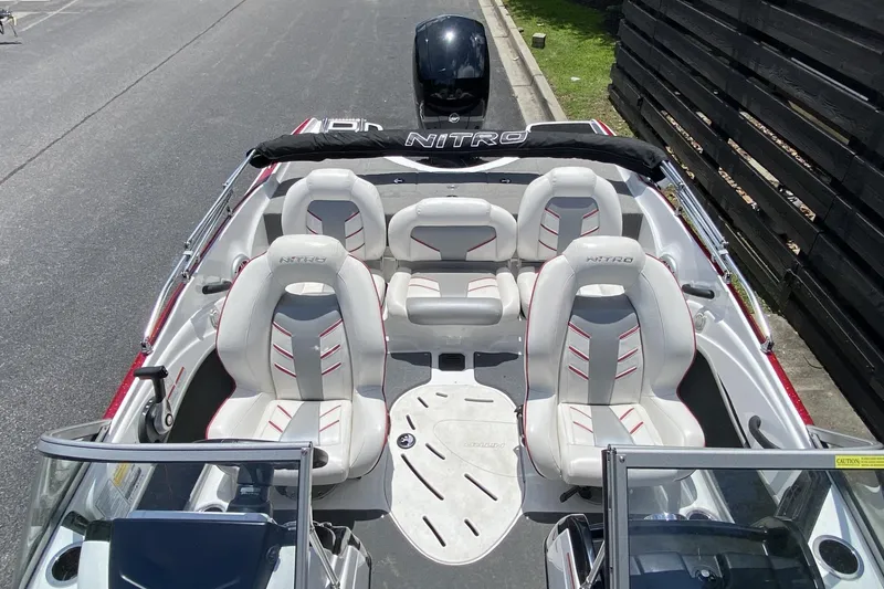 Slide: The Image of 2021 Nitro Z19 Sport boat interior with white seating and sleek design. - 3