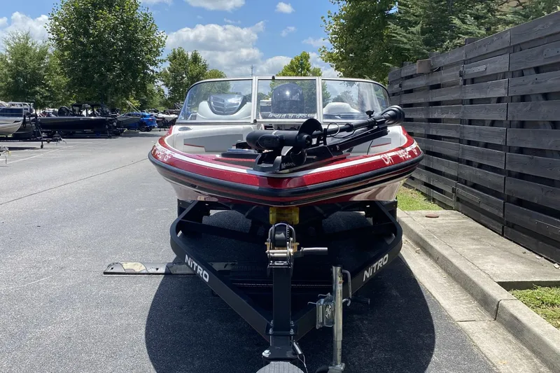 Slide: The Image of 2021 Nitro Z19 Sport boat on trailer in outdoor parking lot. - 7