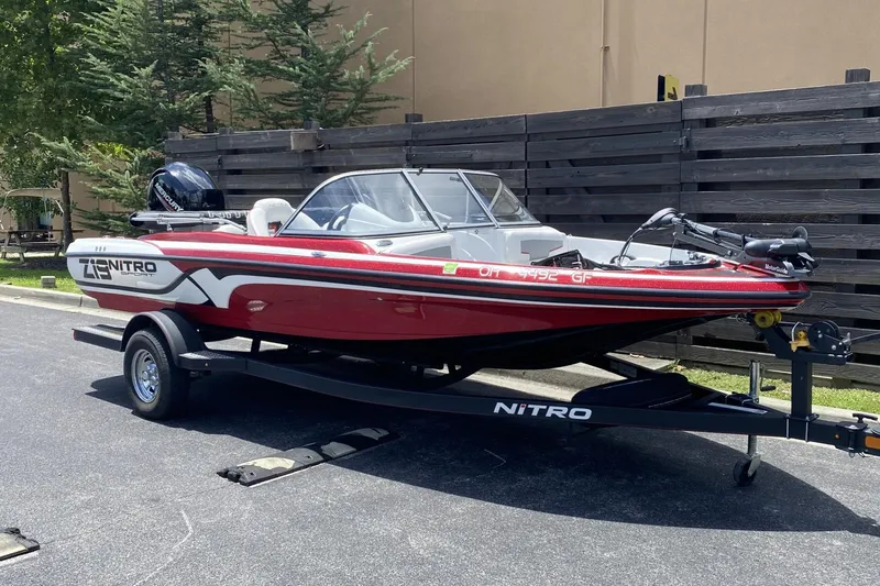 Slide: The Image of 2021 Nitro Z19 Sport boat on trailer, parked outdoors. - 1