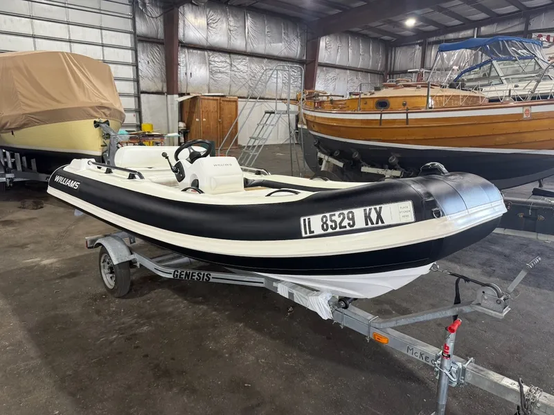 Slide: The Image of A 2019 Williams Jet Tenders 395 Sport Jet on a trailer in a storage facility. - 14