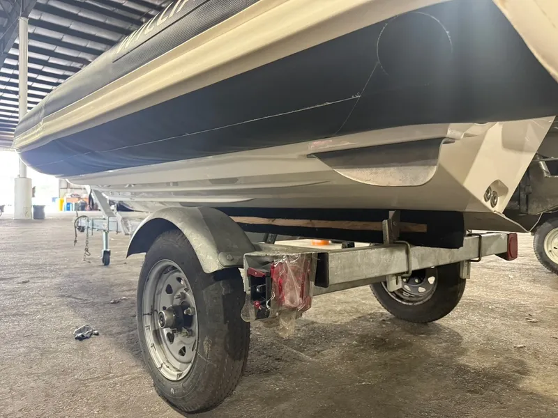 Slide: The Image of A 2019 Williams Jet Tenders 395 Sport Jet on a trailer in a storage facility. - 12