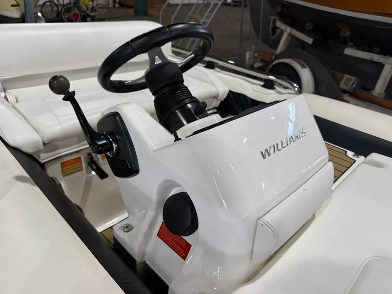 Slide: The Image of The image shows the helm of a 2019 Williams Jet Tenders 395 Sport Jet. - 9