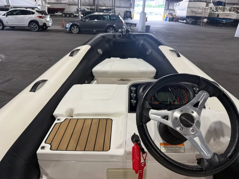 Slide: The Image of The image shows the cockpit of a 2019 Williams Jet Tenders 395 Sport Jet in a warehouse. - 5