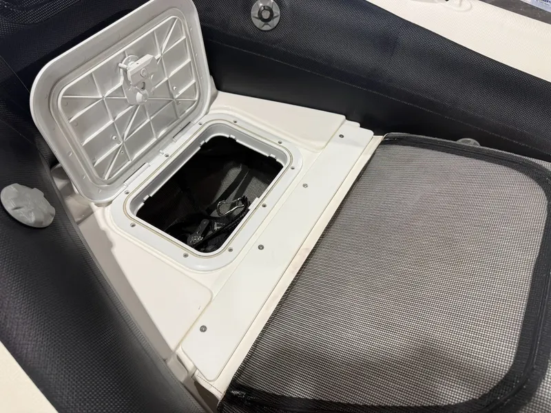 Slide: The Image of An open storage compartment on a 2019 Williams Jet Tenders 395 Sport Jet. - 13
