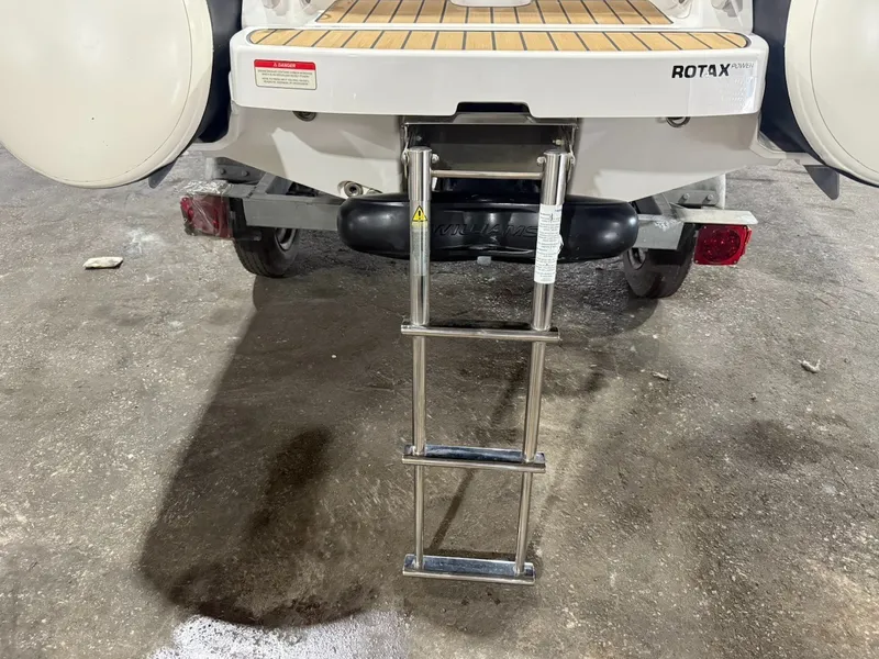 Slide: The Image of A swim ladder at the stern of a 2019 Williams Jet Tenders 395 Sport Jet. - 6