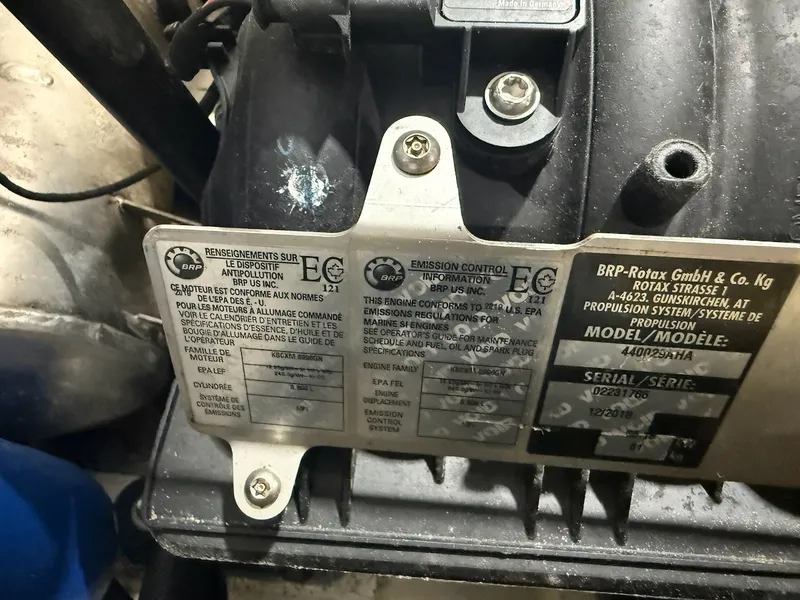 Slide: The Image of Close-up of an engine label with technical information and emission control notices. - 7