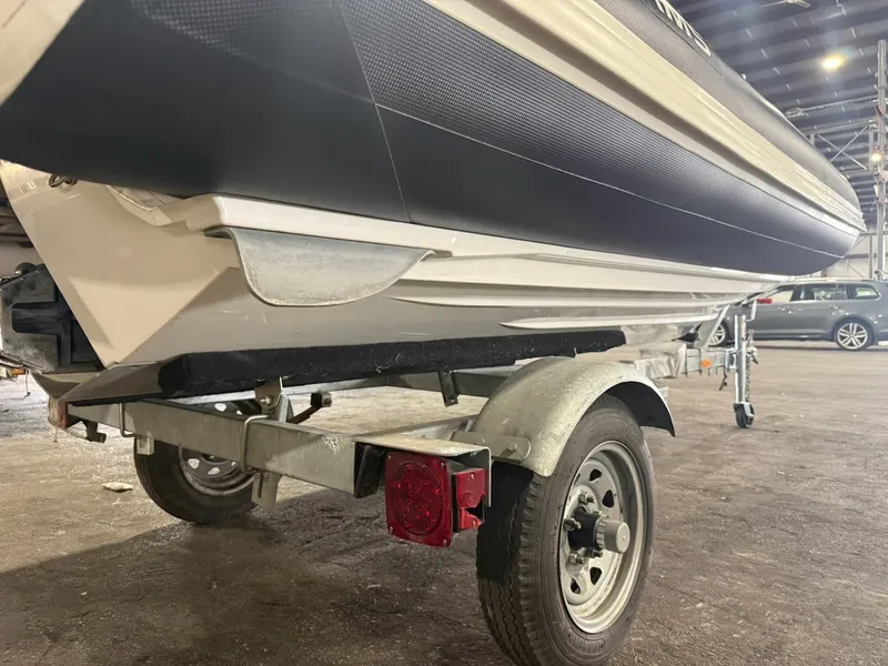 Slide: The Image of A 2019 Williams Jet Tenders 395 Sport Jet on a trailer in a warehouse. - 11