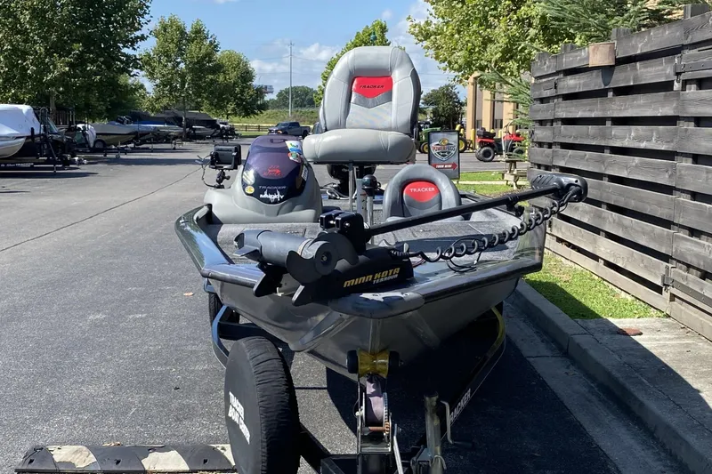 Slide: The Image of 2014 Tracker Pro Team 190 TX boat parked on a sunny day. - 9