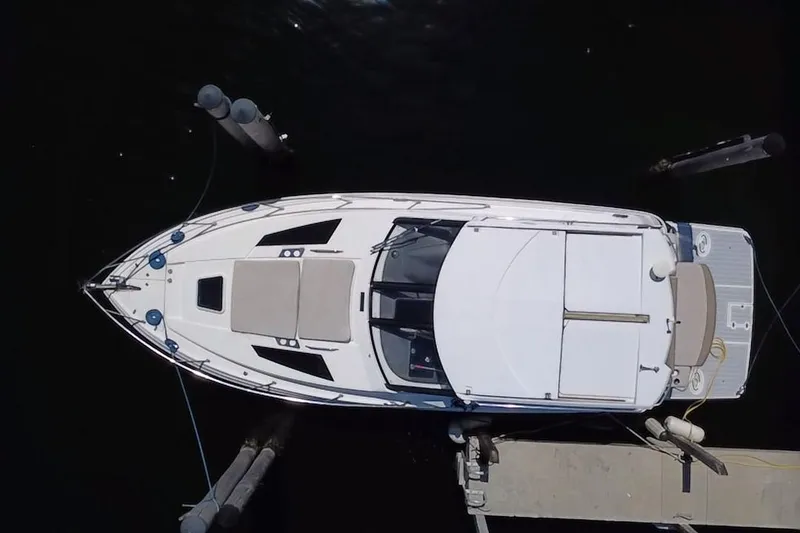 Slide: The Image of Overhead view of a 2015 Regal 35 Sport Coupe docked at a marina. - 1