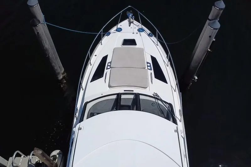 Slide: The Image of Overhead view of a 2015 Regal 35 Sport Coupe yacht docked between pilings. - 7