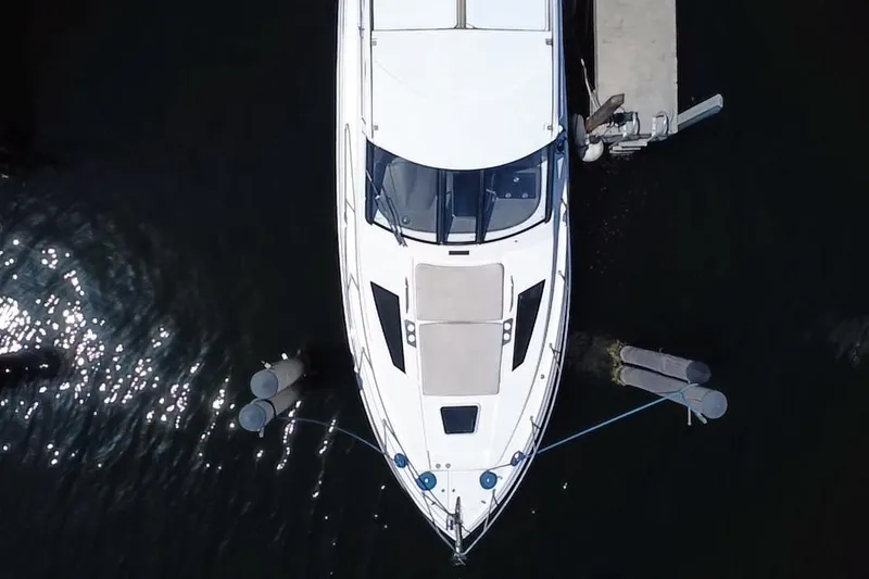 Slide: The Image of Overhead view of a 2015 Regal 35 Sport Coupe docked at a marina. - 3