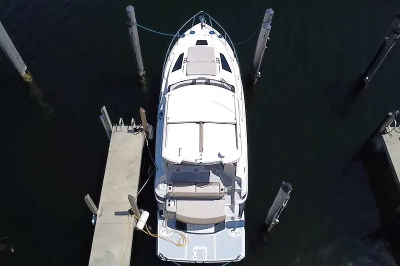 Slide: The Image of Overhead view of a 2015 Regal 35 Sport Coupe docked at a marina. - 0