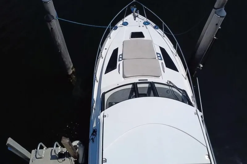 Slide: The Image of Overhead view of a 2015 Regal 35 Sport Coupe docked at a marina. - 5