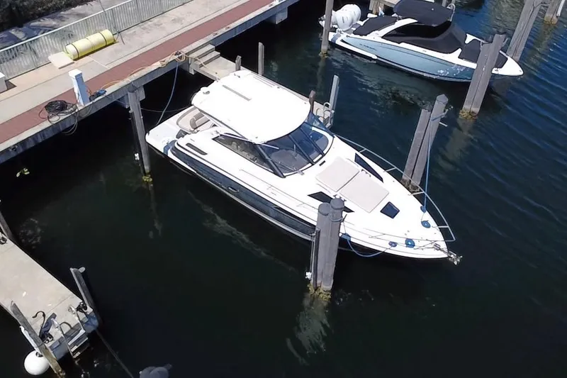 Slide: The Image of 2015 Regal 35 Sport Coupe docked at marina, aerial view. - 9