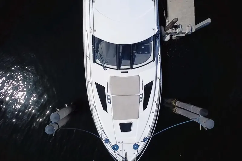 Slide: The Image of Overhead view of a 2015 Regal 35 Sport Coupe docked at a marina. - 8