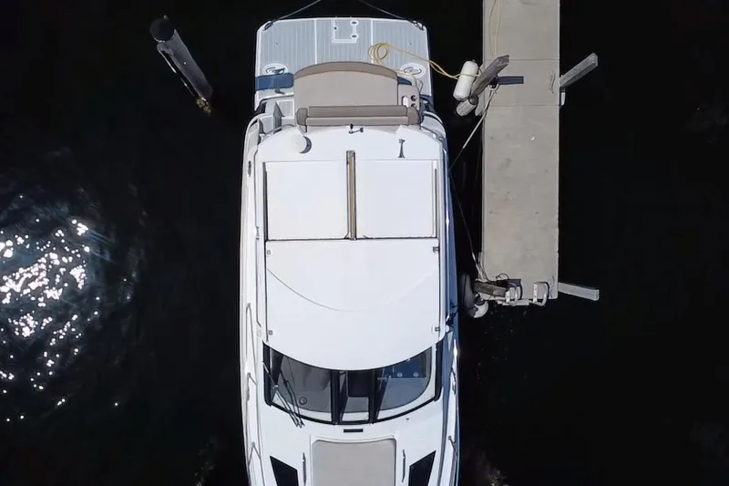 Slide: The Image of Overhead view of a 2015 Regal 35 Sport Coupe docked at a pier. - 2