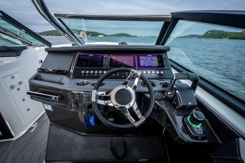 Slide: The Image of Cockpit of 2023 Monterey 378SS Super Sport boat with advanced navigation controls. - 17
