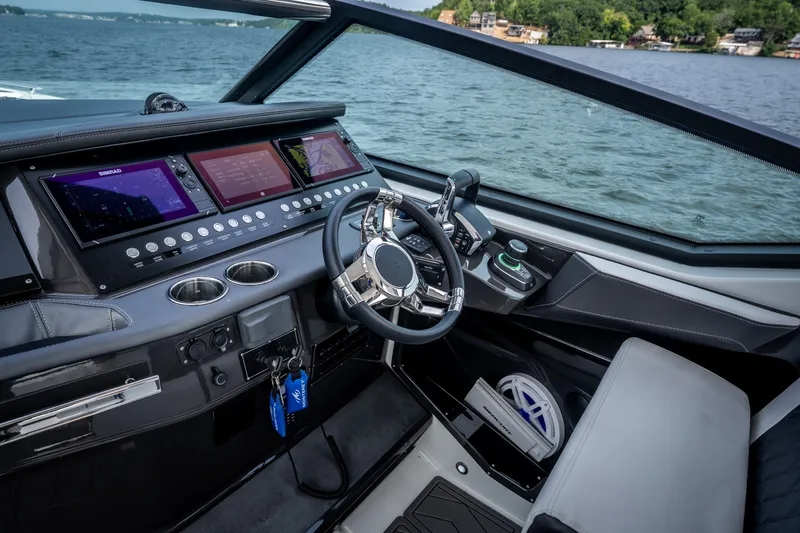 Slide: The Image of Cockpit of 2023 Monterey 378SS Super Sport boat with advanced navigation displays. - 14
