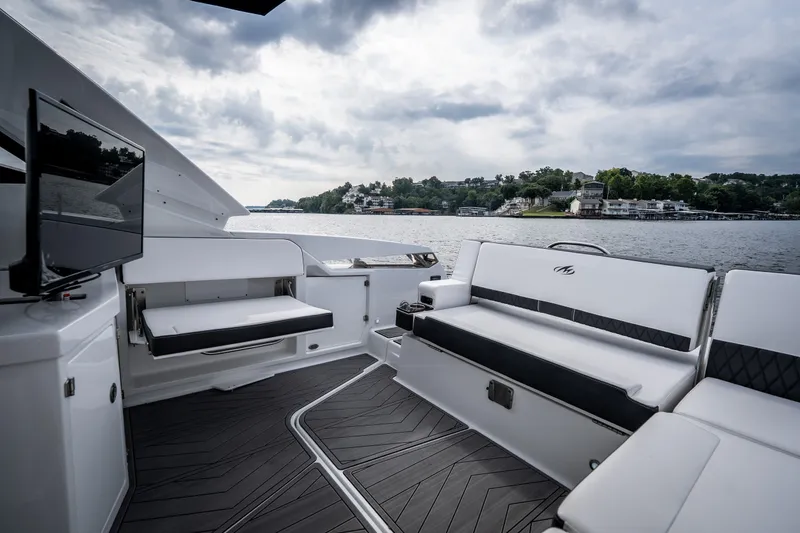 Slide: The Image of Luxurious 2023 Monterey 378SS Super Sport boat interior with scenic lake view. - 10