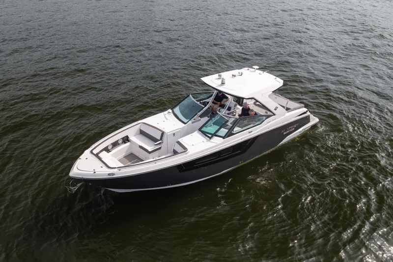 Slide: The Image of 2023 Monterey 378SS Super Sport boat cruising on open water. - 3