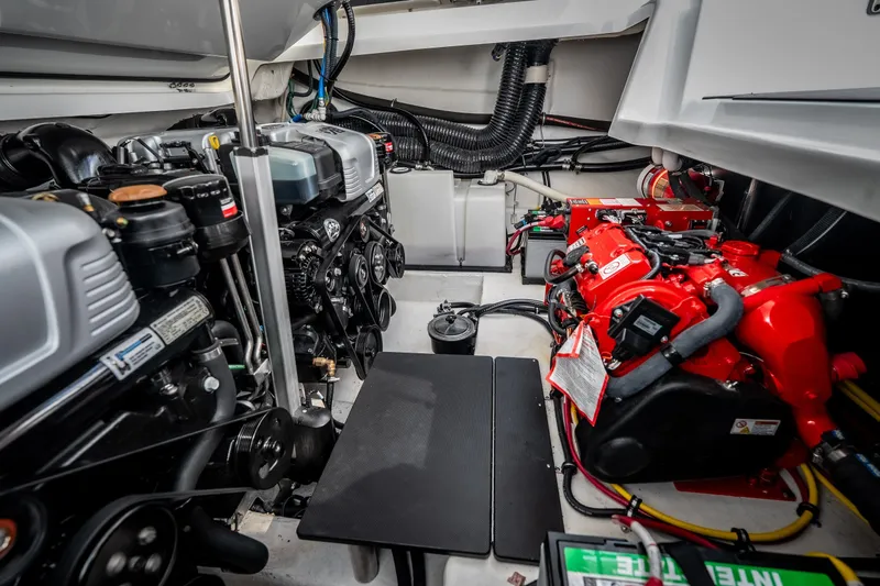 Slide: The Image of Engine compartment of 2023 Monterey 378SS Super Sport boat, showcasing dual engines and components. - 41