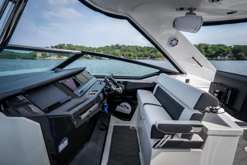 Slide: The Image of 2023 Monterey 378SS Super Sport boat interior with sleek dashboard and luxurious seating. - 13