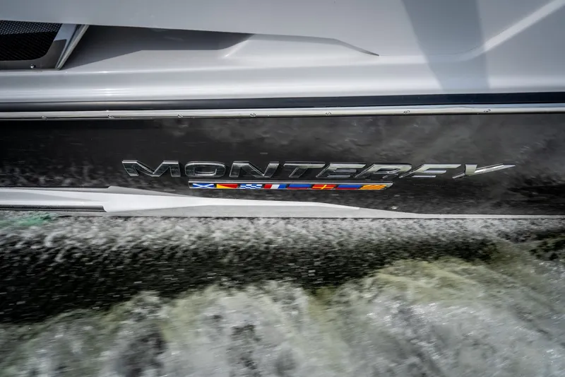 Slide: The Image of 2023 Monterey 378SS Super Sport boat cruising on water, showcasing sleek design. - 6