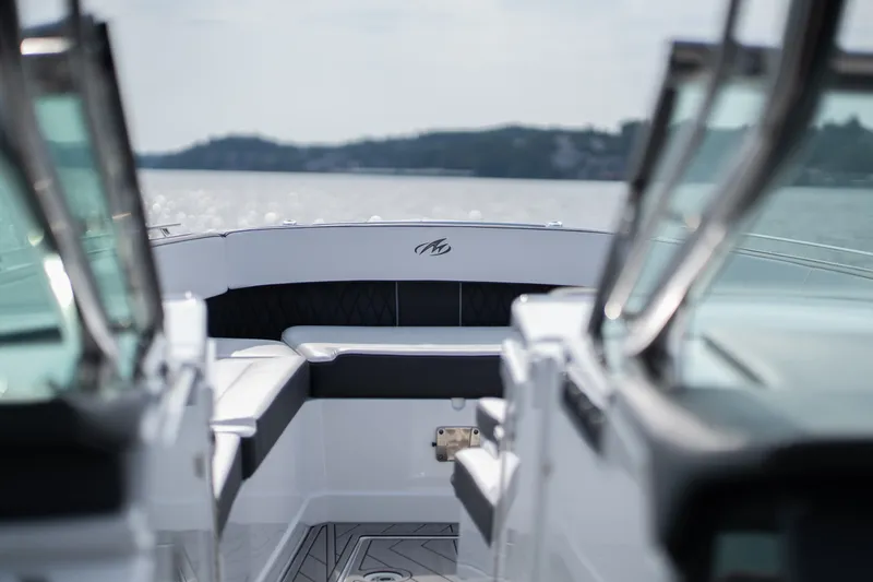 Slide: The Image of 2023 Monterey 378SS Super Sport boat interior with sleek seating and lake view. - 21