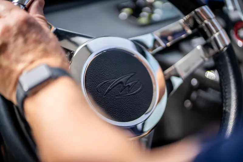 Slide: The Image of Steering wheel of 2023 Monterey 378SS Super Sport boat, featuring sleek chrome design. - 49