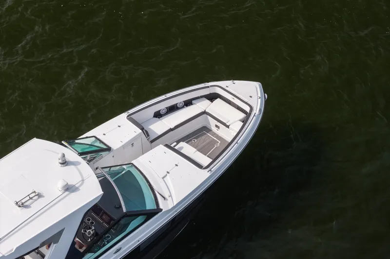 Slide: The Image of 2023 Monterey 378SS Super Sport boat on water, aerial view of sleek design and spacious seating. - 25