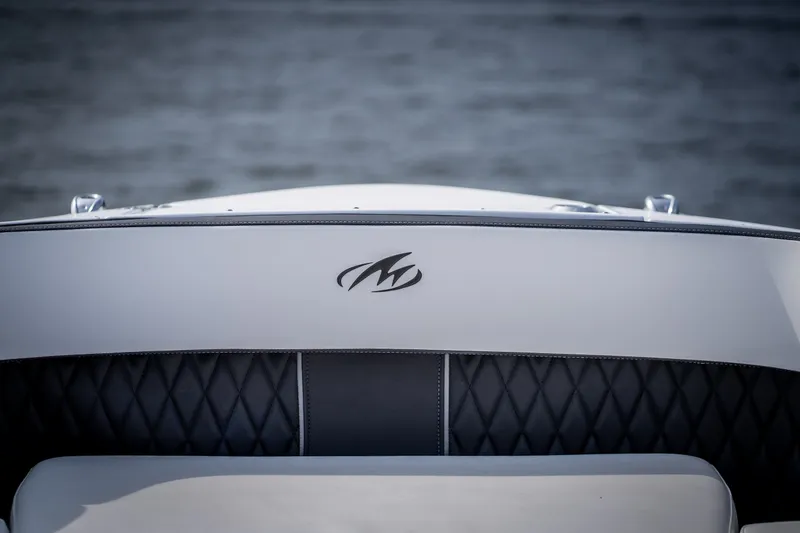 Slide: The Image of 2023 Monterey 378SS Super Sport boat interior with logo, featuring quilted upholstery. - 26