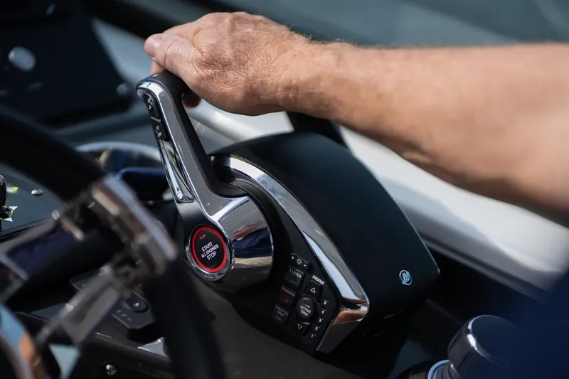 Slide: The Image of Hand operating throttle control on 2023 Monterey 378SS Super Sport boat. - 47