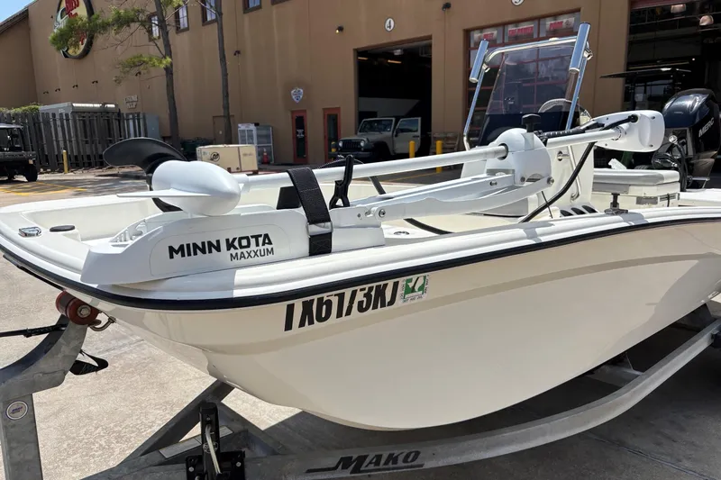 Slide: The Image of 2021 Mako Pro Skiff 15 CC with Minn Kota Maxxum trolling motor on trailer. - 4