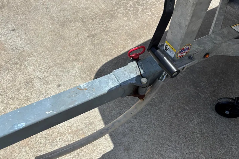 Slide: The Image of Trailer hitch of a 2021 Mako Pro Skiff 15 CC on concrete surface. - 5