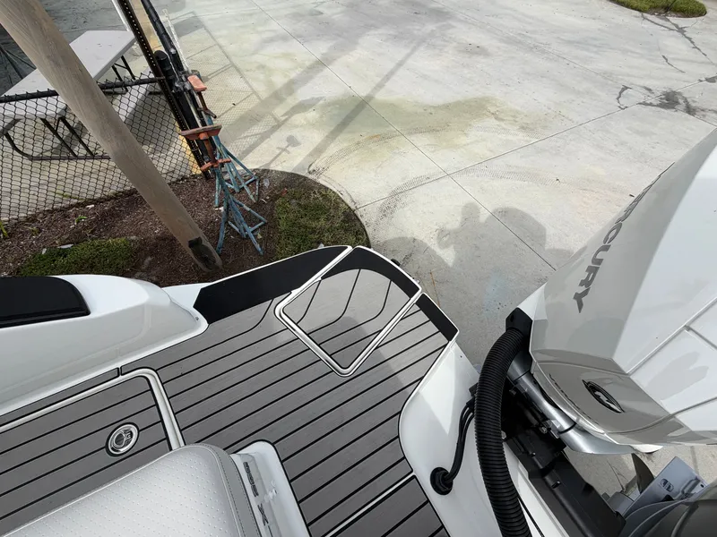 Slide: The Image of The image shows the stern of a Sea Ray SLX 280 Outboard with a Mercury outboard motor. - 7