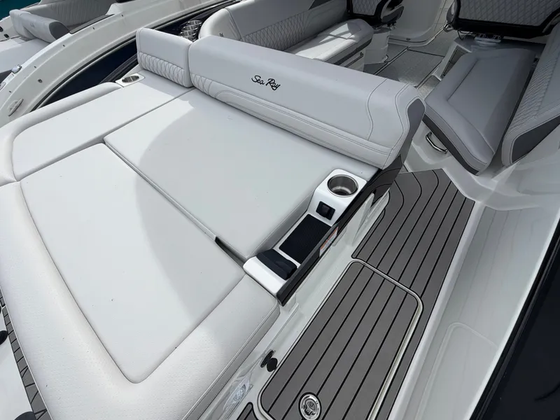 Slide: The Image of The image shows the luxurious cockpit of a Sea Ray SLX 280 Outboard with sleek white upholstery. - 11