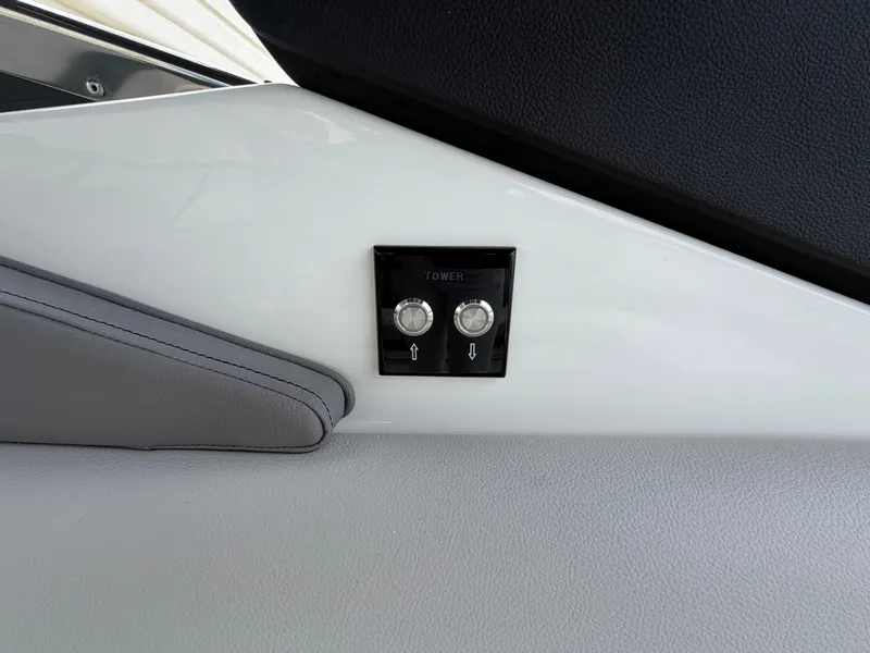 Slide: The Image of Close-up of a control panel with two buttons on a Sea Ray SLX 280 Outboard. - 34